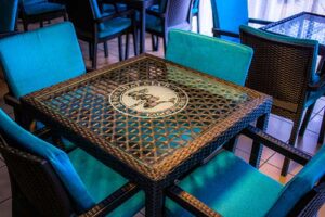 Outdoor dining table and seating at the Club
