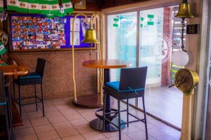 Bar area and tables inside the Club